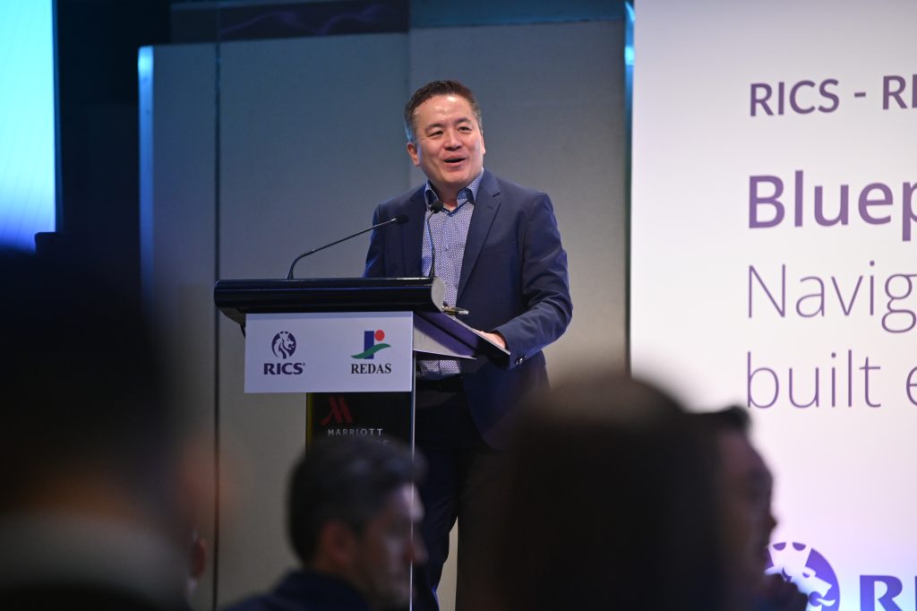 BCA CEO Kelvin Wong delivering his keynote address at the RICS-REDAS Conference 2025